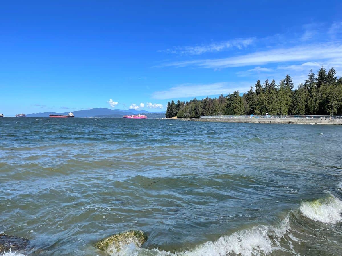 View of cargo ships at second beach in vancouver