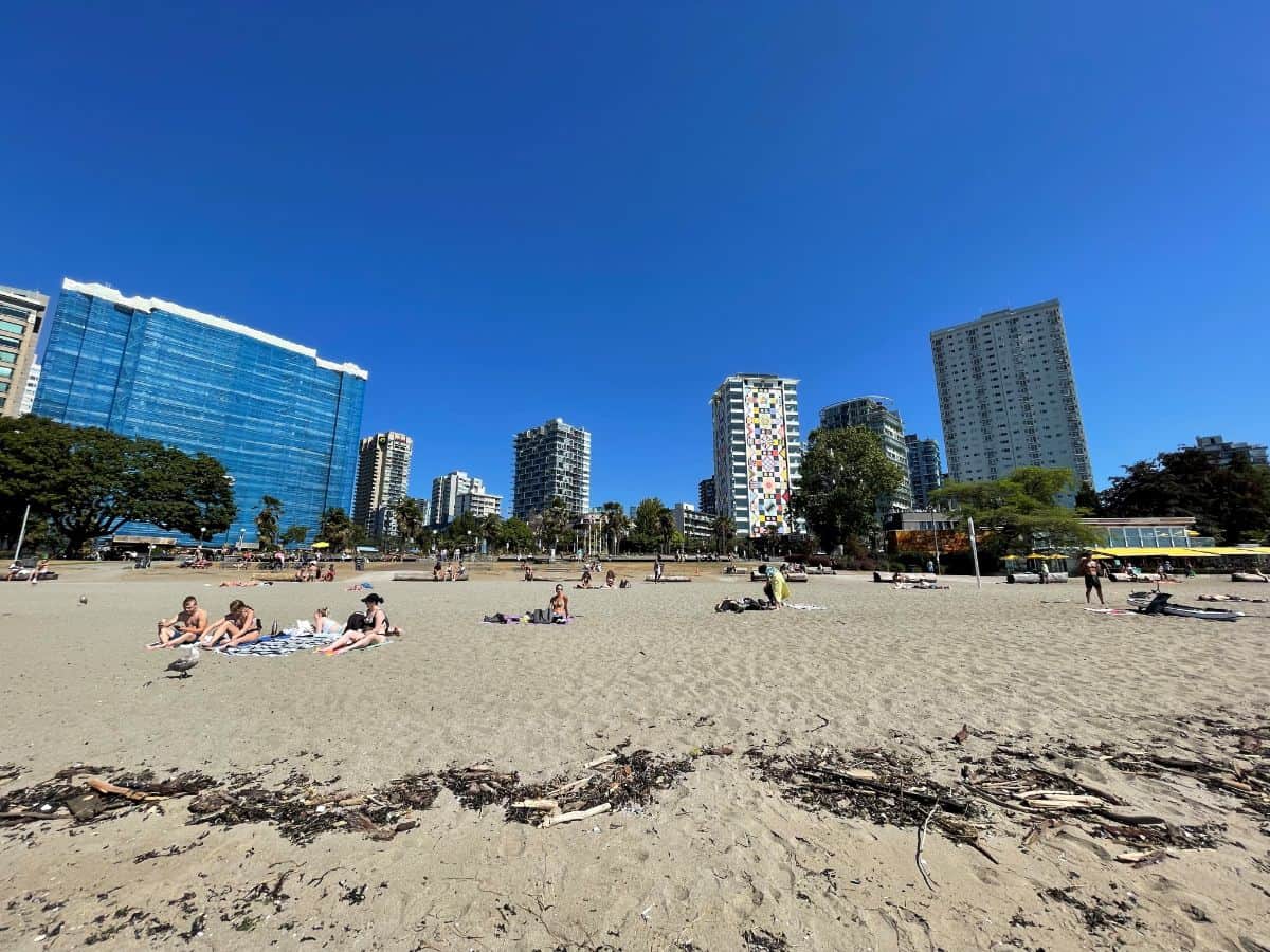 english bay beach looking towards the seawall in vancouver bc