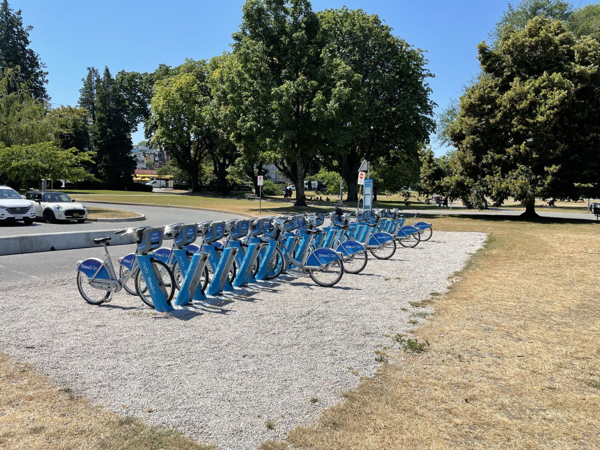 Bike rack of mobi share bikes at kits beach in vancouver