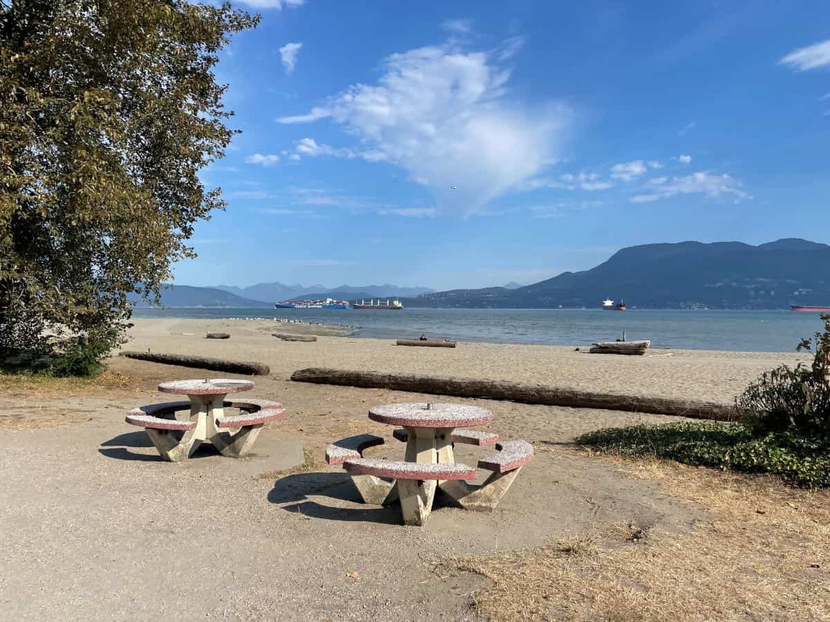 picnic tables at spanish banks beach cafe in vancouver