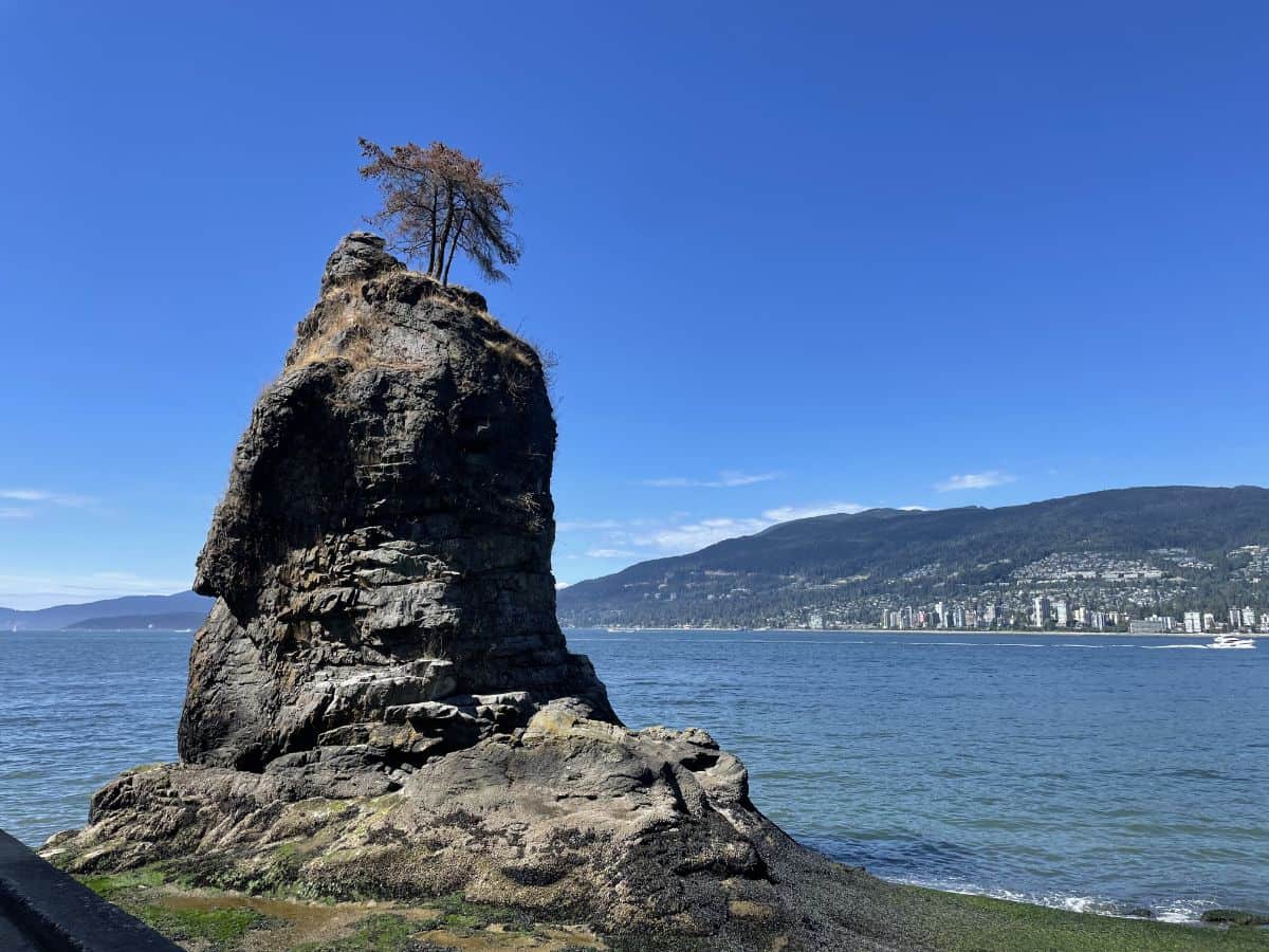 Siwash rock with west vancouver in the background