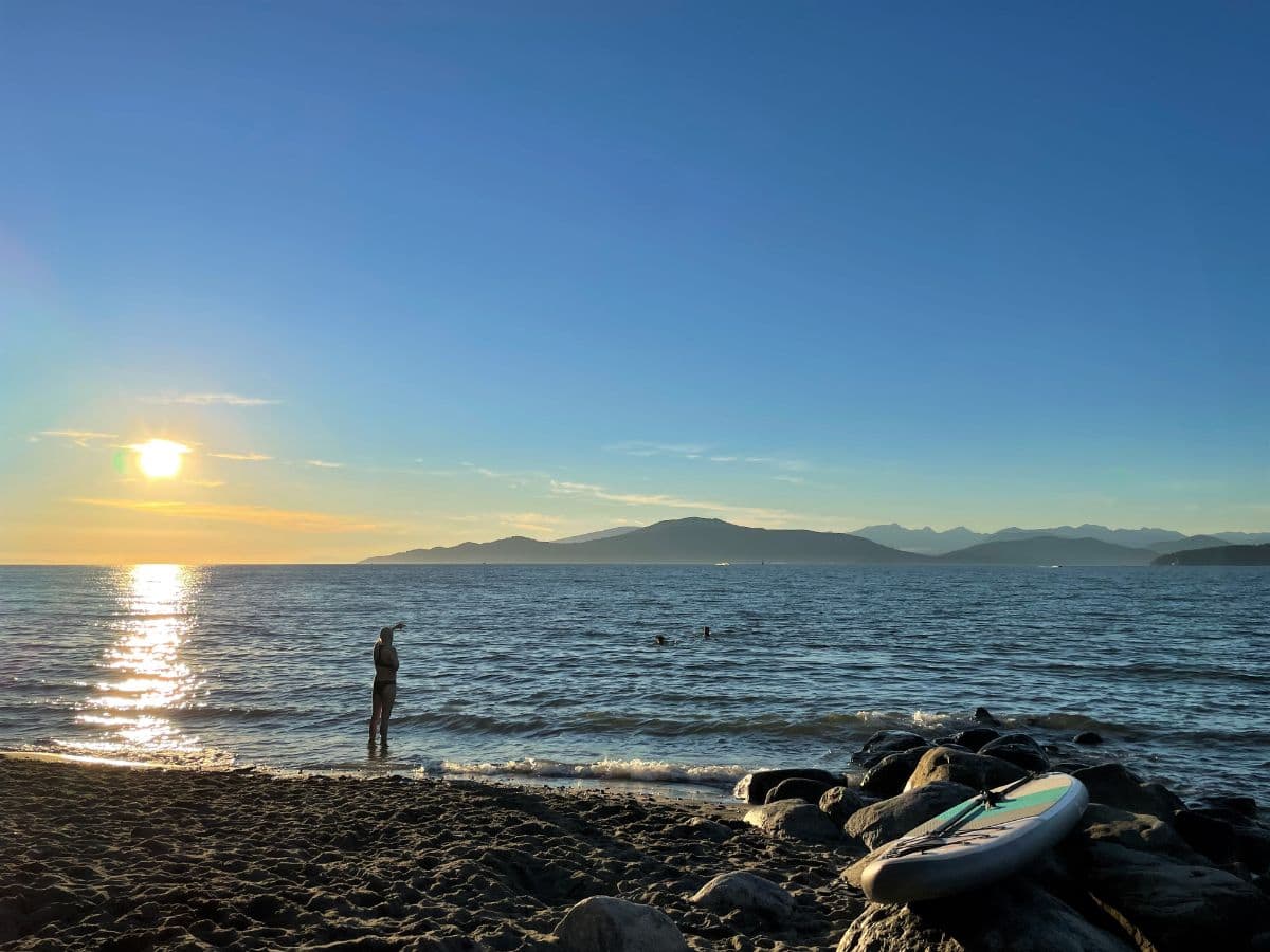 sunset swimmers at spanish banks in vancouver