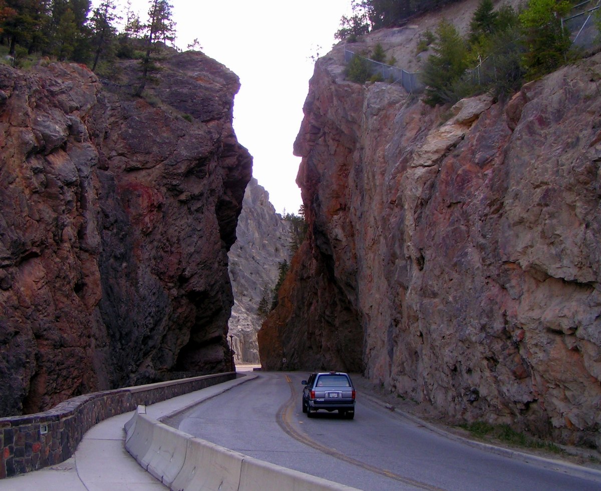 Highway 93 passing through narrow red-rock Sinclair Canyon