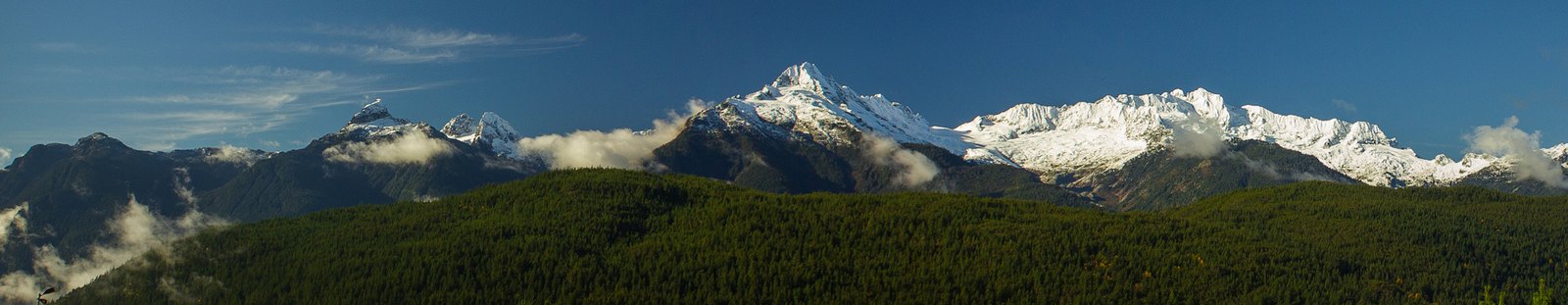 Snow-capped Tantalus Range above forested hills near Squamish