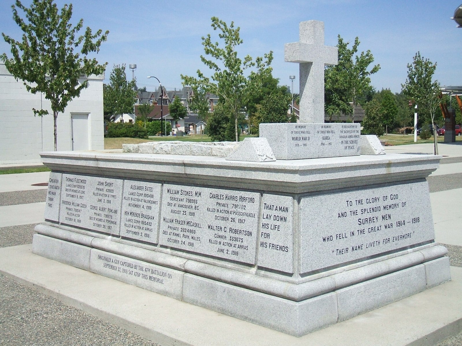Granite Surrey war memorial cenotaph with cross in Cloverdale plaza